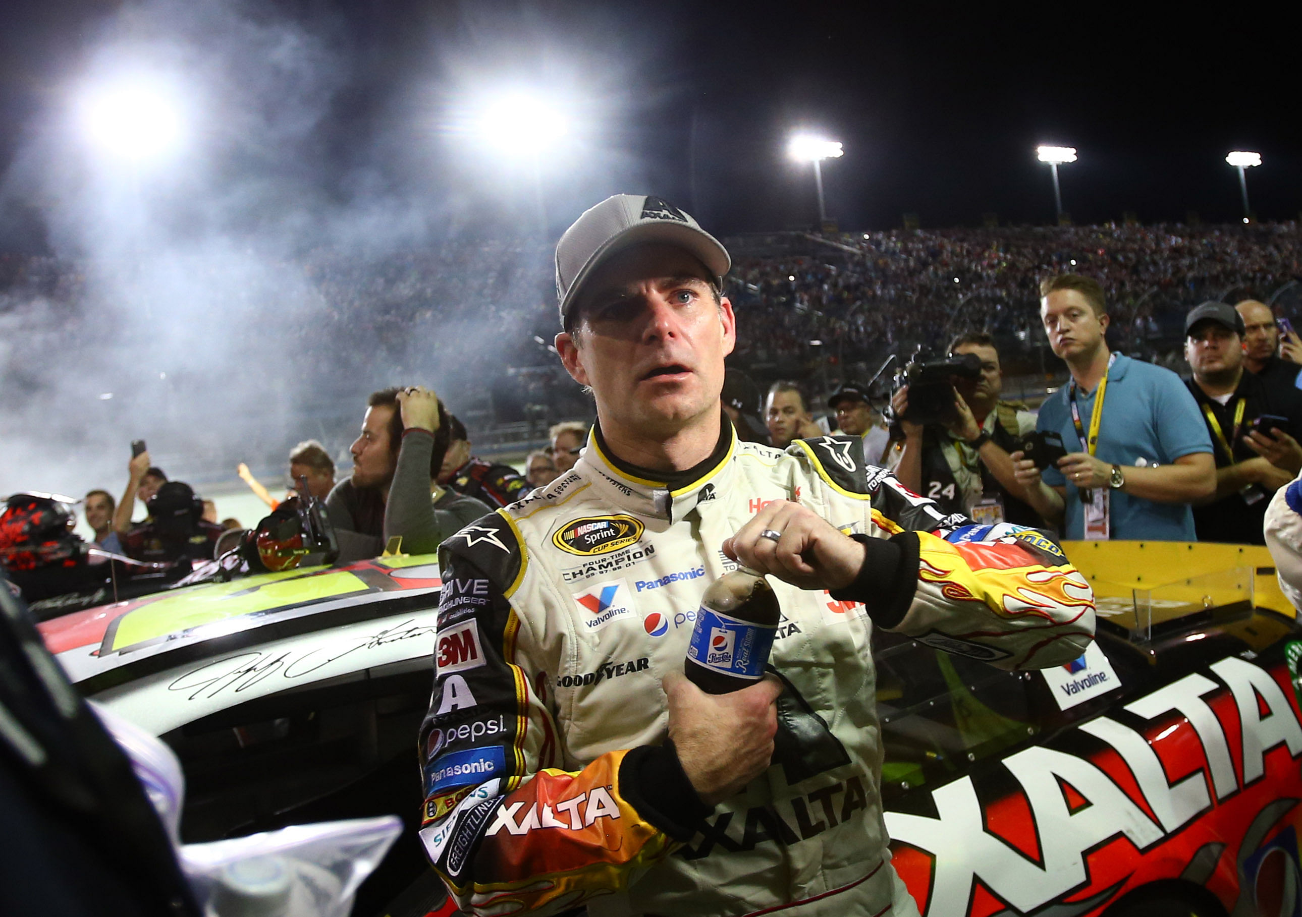 NASCAR Sprint Cup Series driver Jeff Gordon waits to be interviewed on pit road outside of his car following the Ford EcoBoost 400 at Homestead-Miami Speedway - Source: Imagn